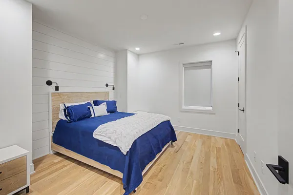 a bedroom with a bed and a dresser