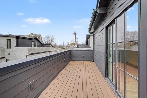a view of balcony with wooden floor