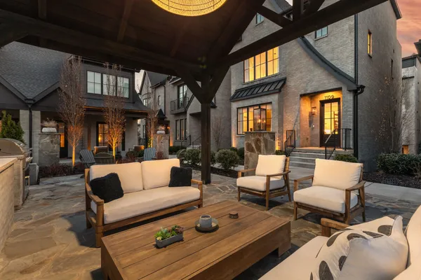 a outdoor living space with furniture and a fireplace