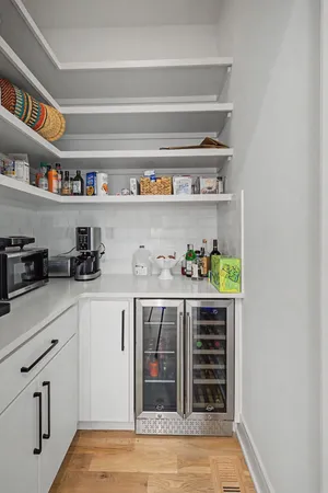 a kitchen with stainless steel appliances and cabinets
