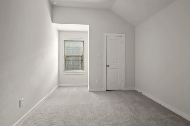 a view of a house with a yard and plants