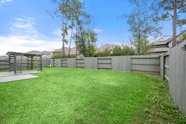 a front view of a house with a yard table and chairs