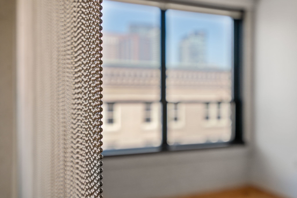210 Lincoln Street, Unit 601 Boston, MA 02111 - Photo 12 of 29 a view of a glass window with a glass door