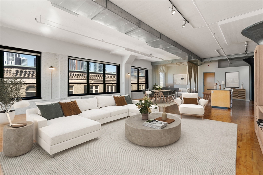 210 Lincoln Street, Unit 601 Boston, MA 02111 - Photo 14 of 29 a living room with furniture and a large window