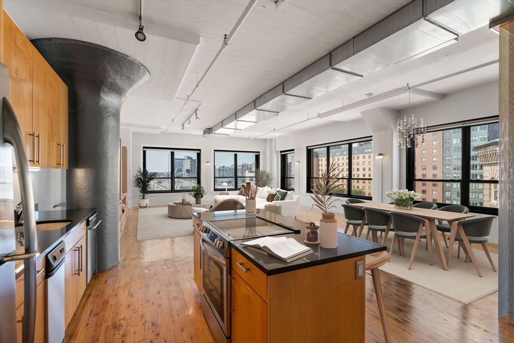 210 Lincoln Street, Unit 601 Boston, MA 02111 - Photo 2 of 29 a view of living room with furniture large window and flat screen tv