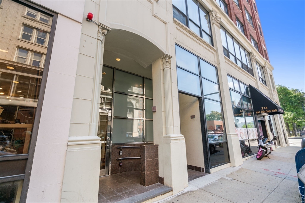 210 Lincoln Street, Unit 601 Boston, MA 02111 - Photo 26 of 29 a view of shops in a living room