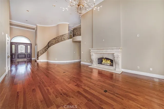 a view of livingroom and dining room with wooden floor
