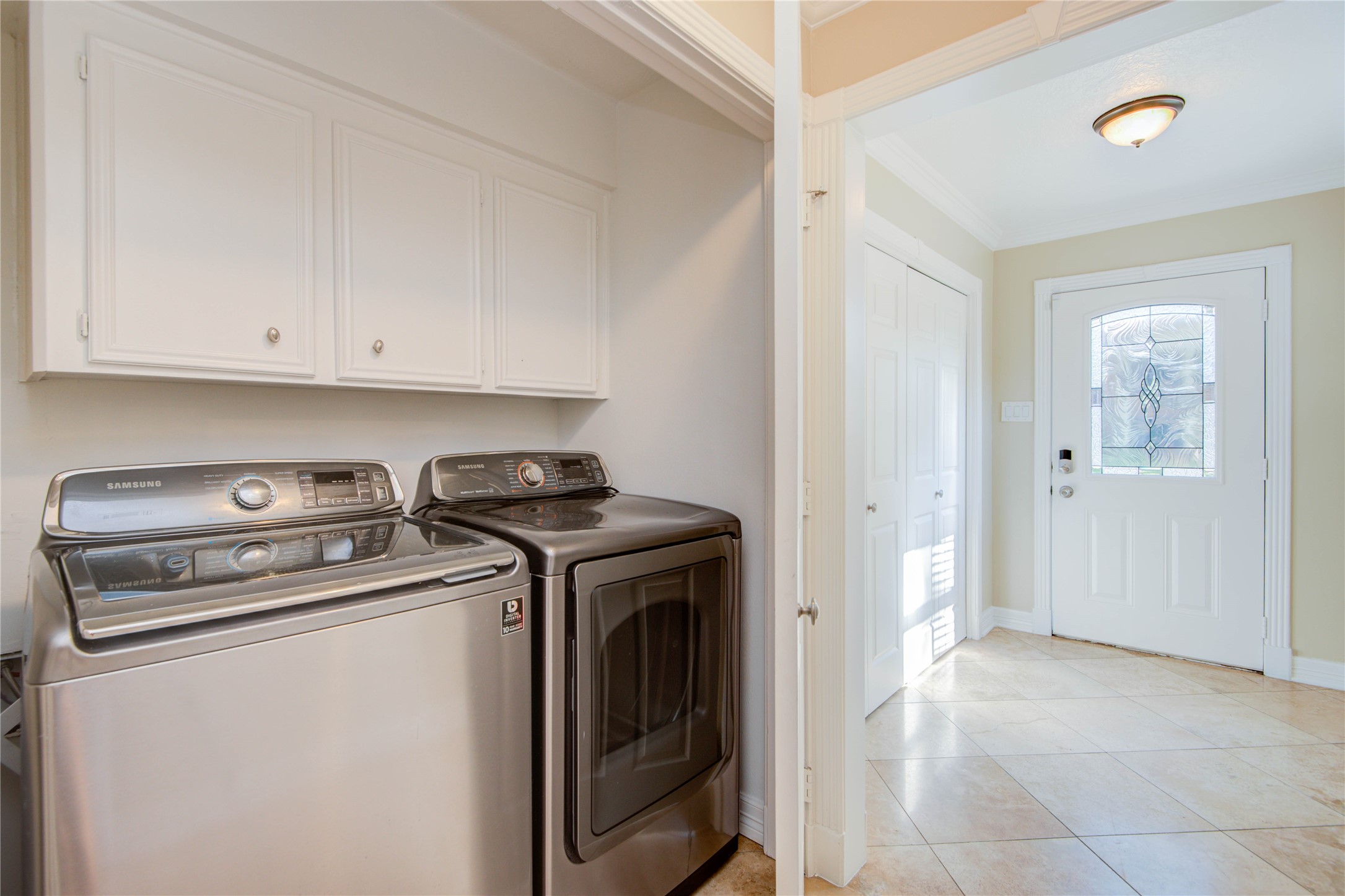 8906 Herts Road Spring, TX 77379 - Photo 14 of 43 a view of storage and utility room with washer and dryer