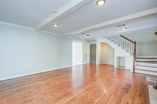 a view of an entryway with wooden floor