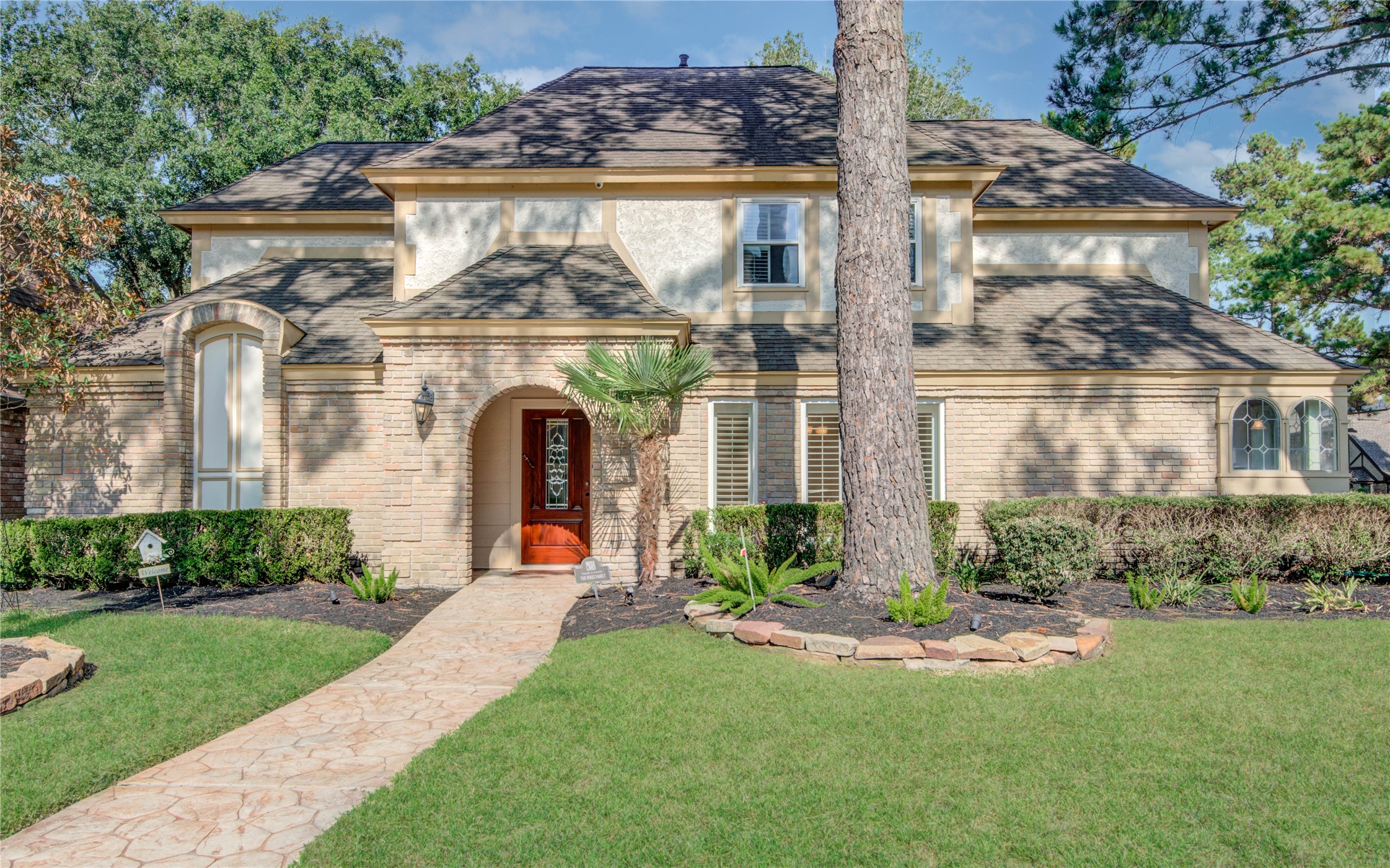 8906 Herts Road Spring, TX 77379 - Photo 2 of 43 a front view of a house with garden