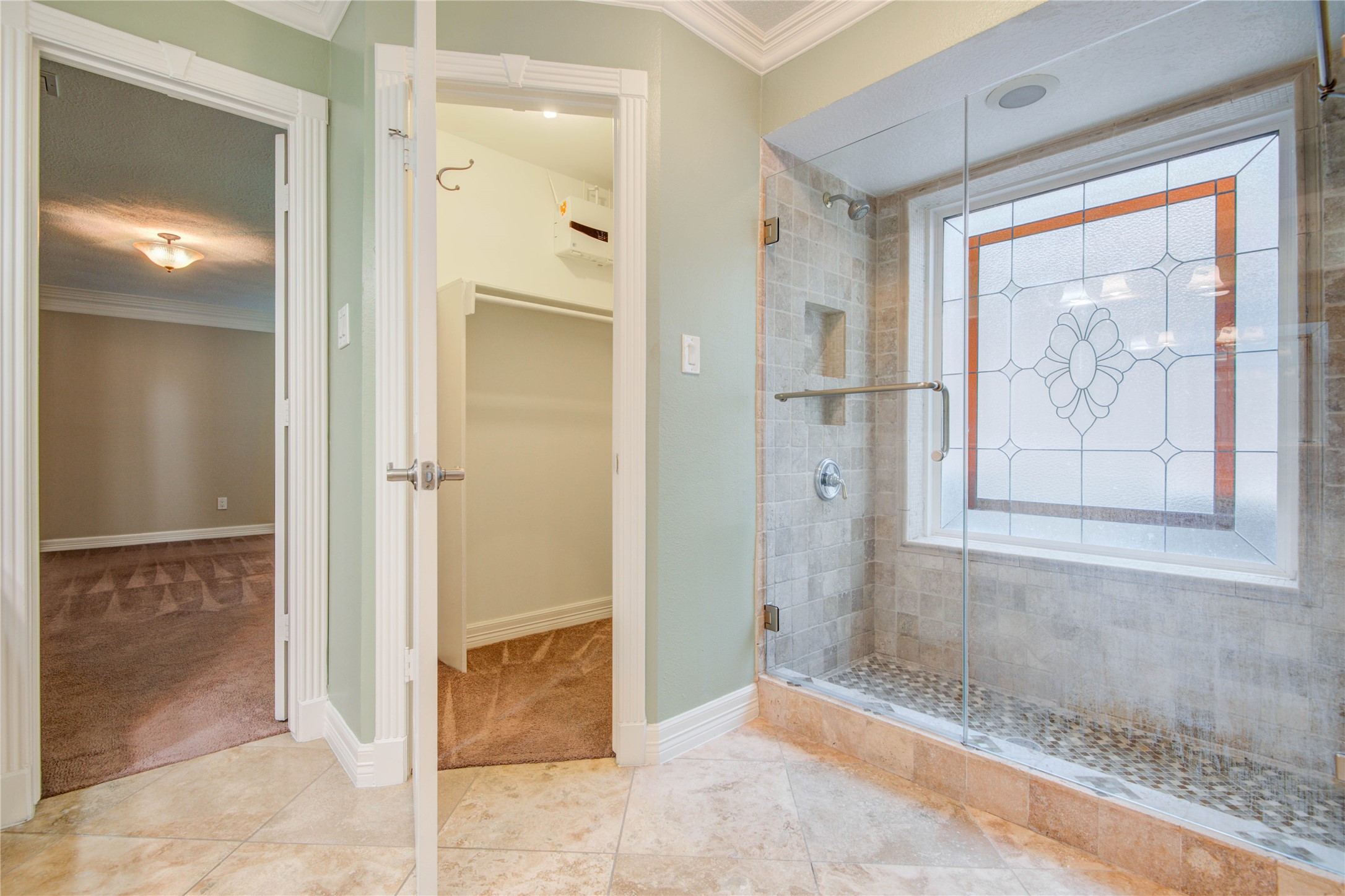 8906 Herts Road Spring, TX 77379 - Photo 26 of 43 a view of a bathroom with a glass door shower