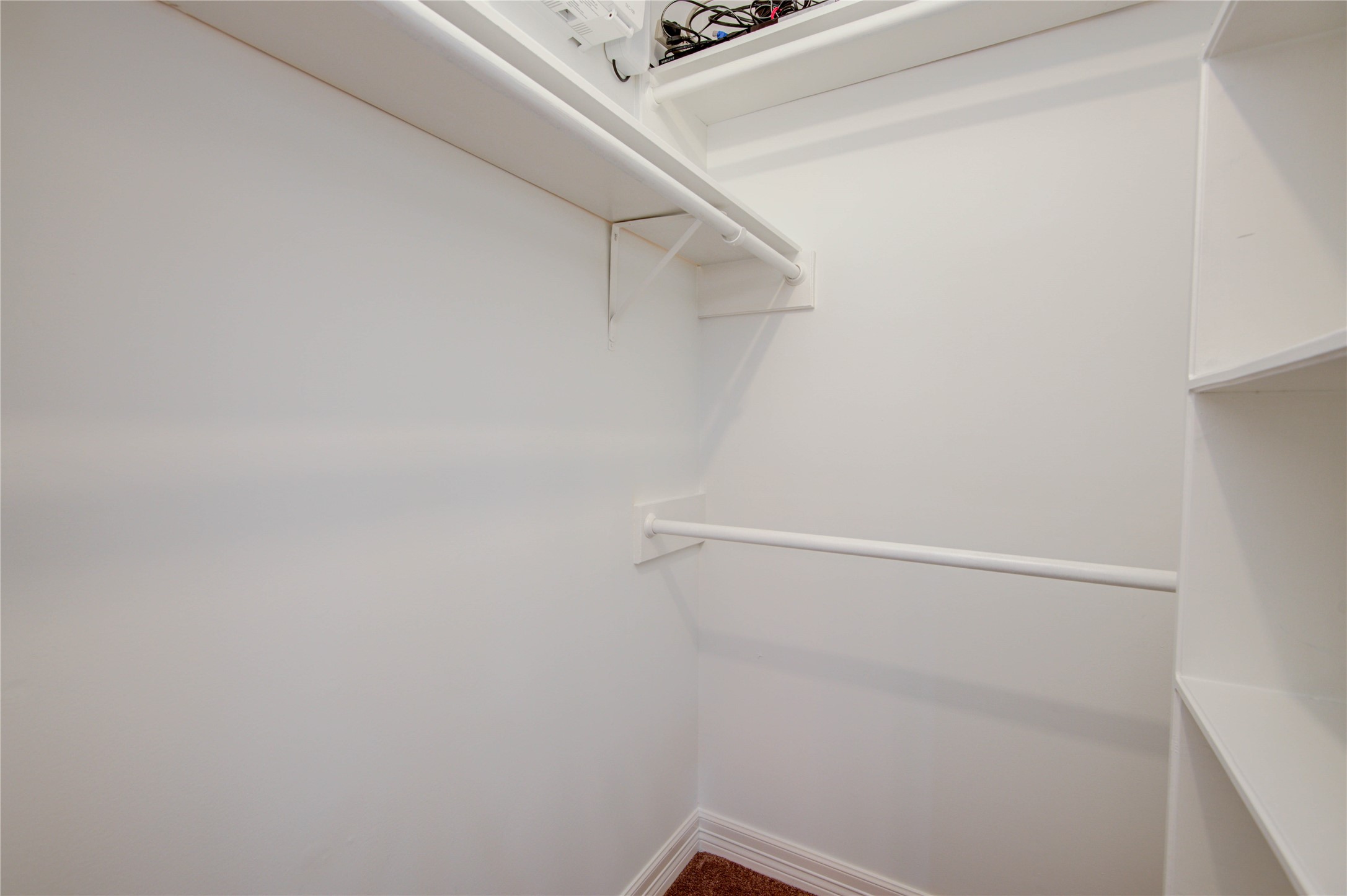 8906 Herts Road Spring, TX 77379 - Photo 28 of 43 a view of small space with racks on the wall