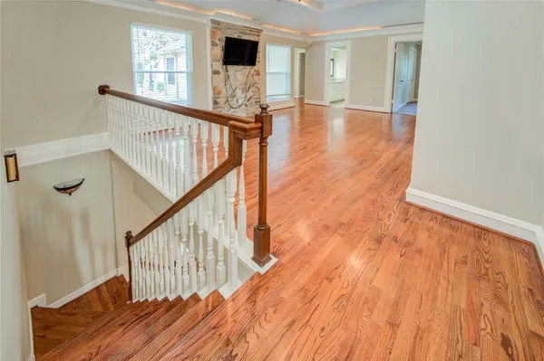 a view of an entryway with wooden floor