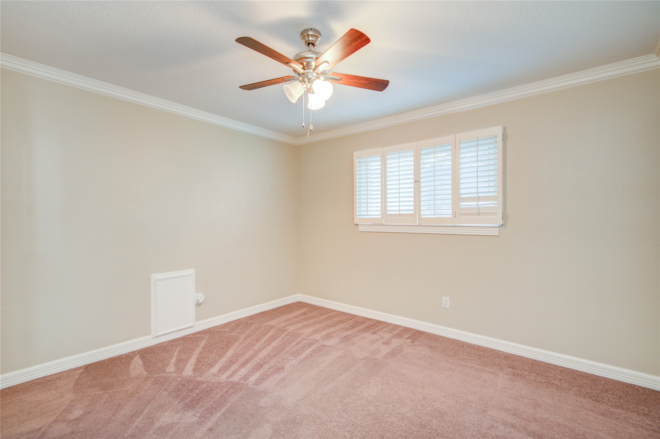 8906 Herts Road Spring, TX 77379 - Photo 34 of 43 an empty room with windows and fan