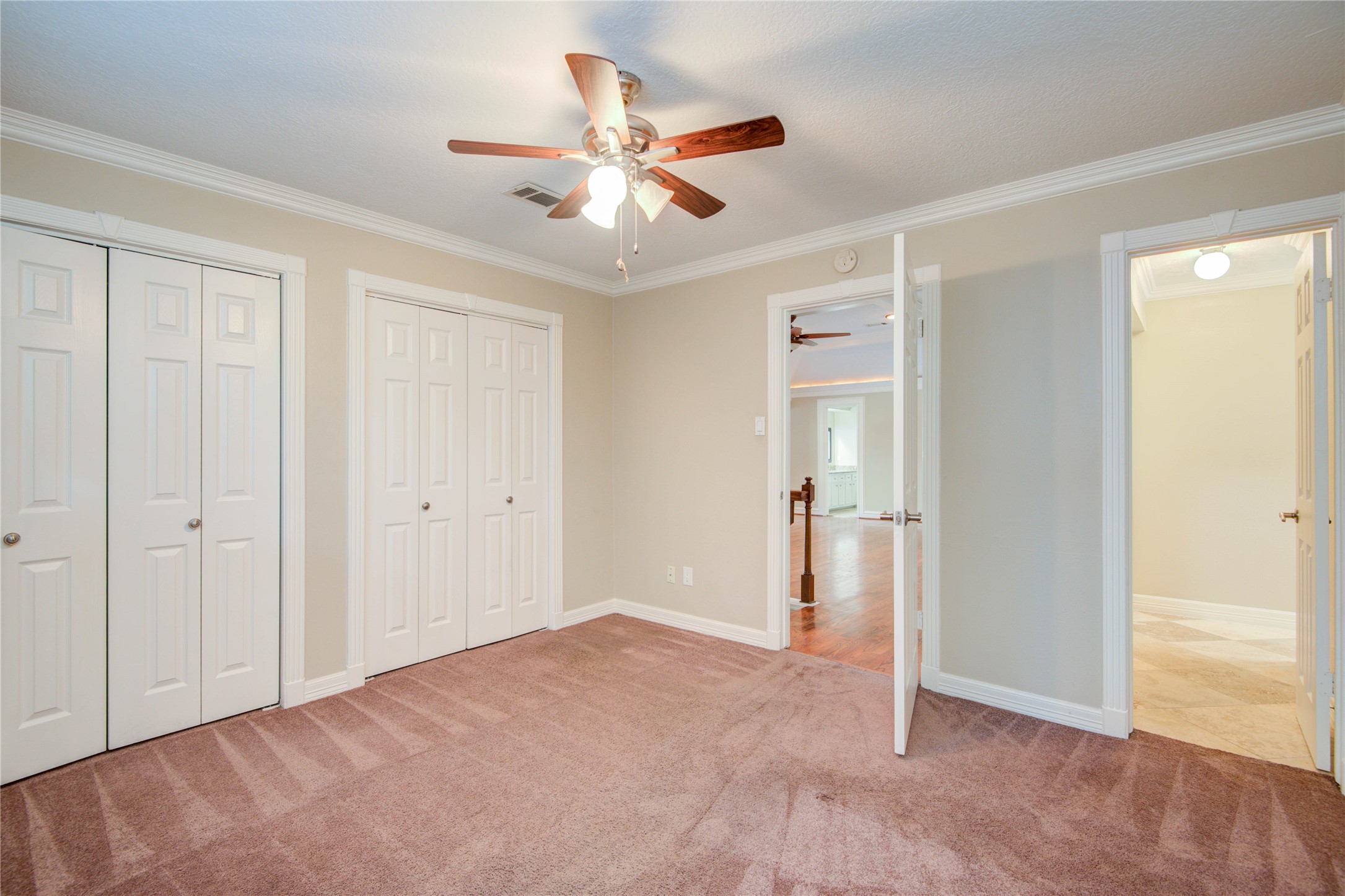 8906 Herts Road Spring, TX 77379 - Photo 35 of 43 a view of a livingroom with a ceiling fan & entryway