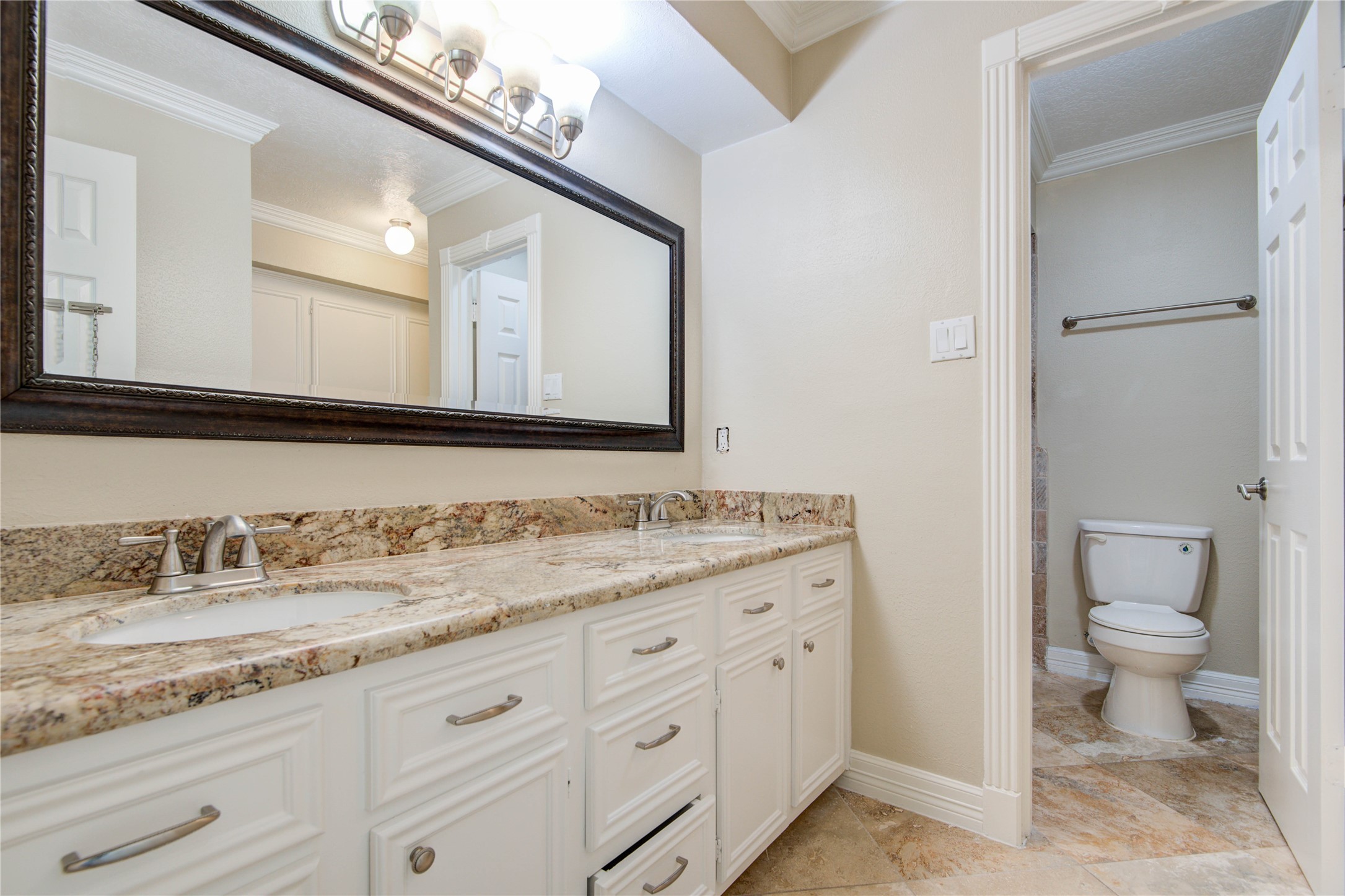 8906 Herts Road Spring, TX 77379 - Photo 36 of 43 a bathroom with a granite countertop sink mirror and toilet