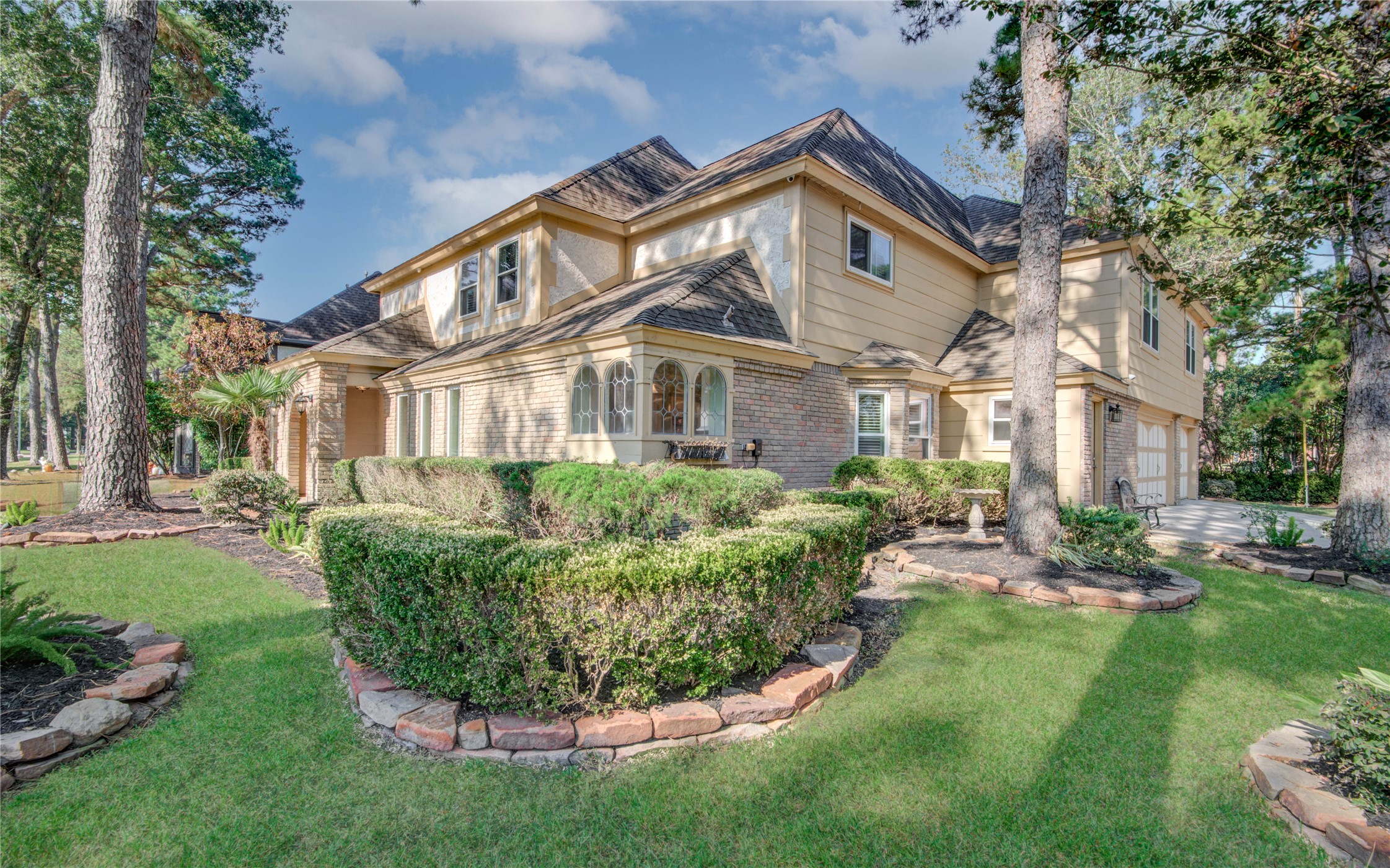 8906 Herts Road Spring, TX 77379 - Photo 4 of 43 a front view of a house with a yard table and chairs