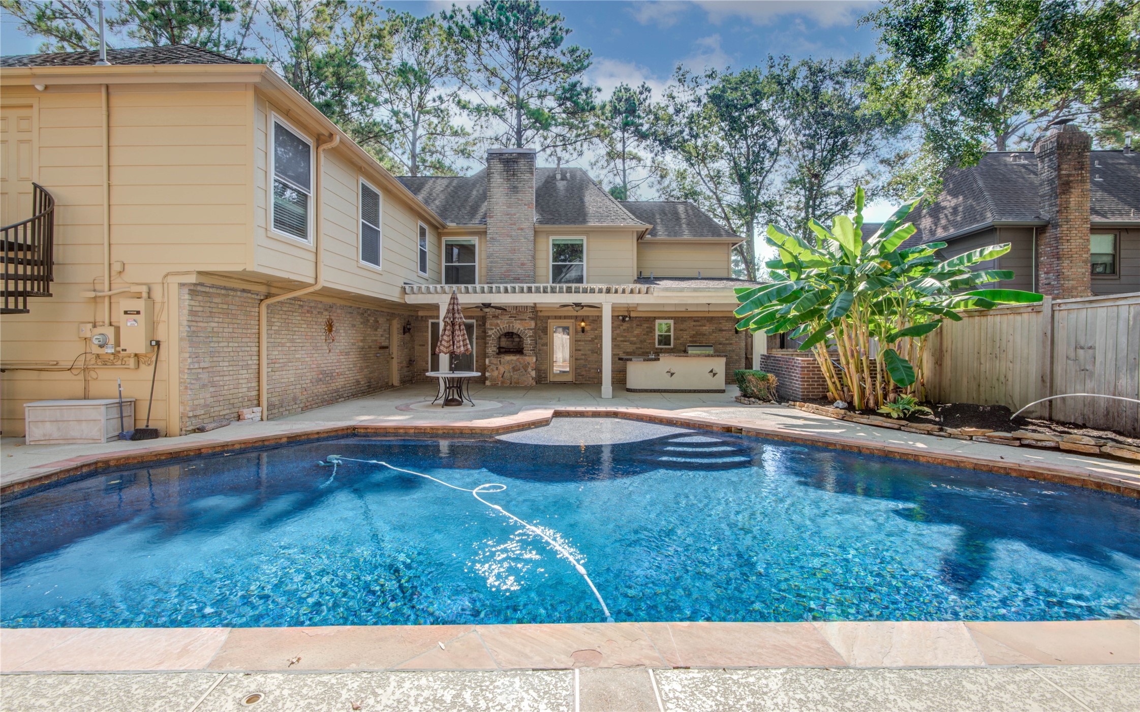 8906 Herts Road Spring, TX 77379 - Photo 42 of 43 a swimming pool with outdoor seating and yard
