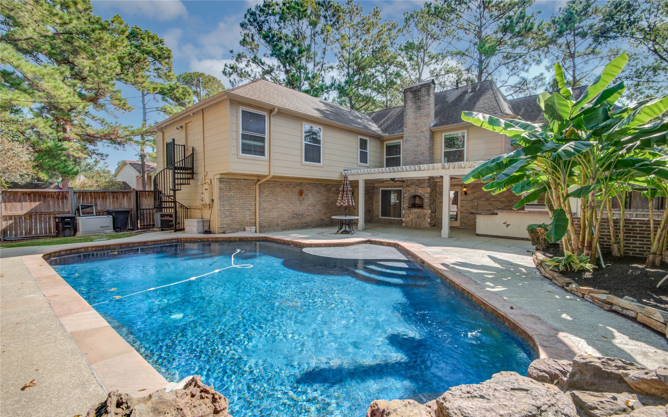 8906 Herts Road Spring, TX 77379 - Photo 43 of 43 a view of a house with swimming pool and sitting area
