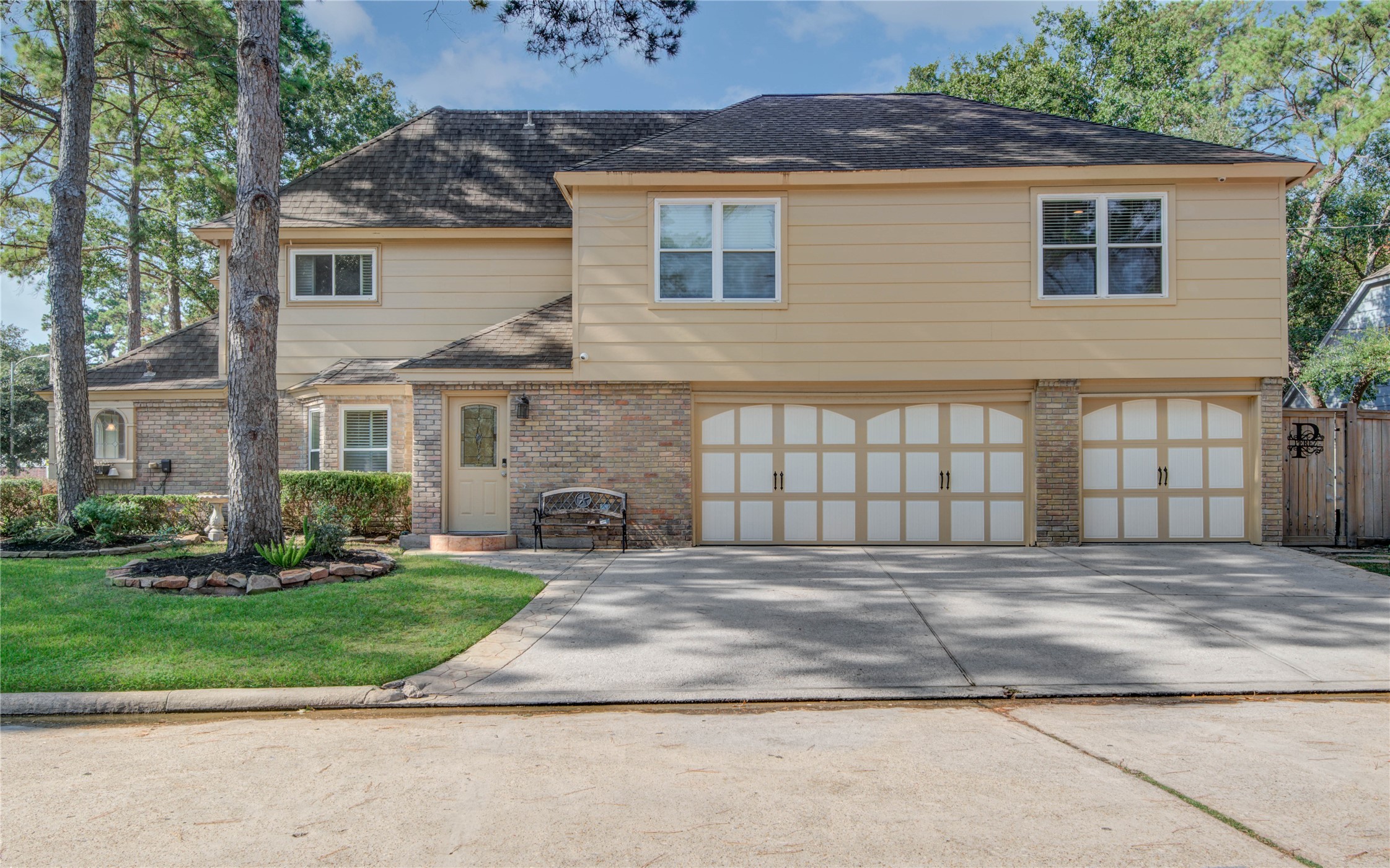 8906 Herts Road Spring, TX 77379 - Photo 5 of 43 a front view of a house with a garden and plants