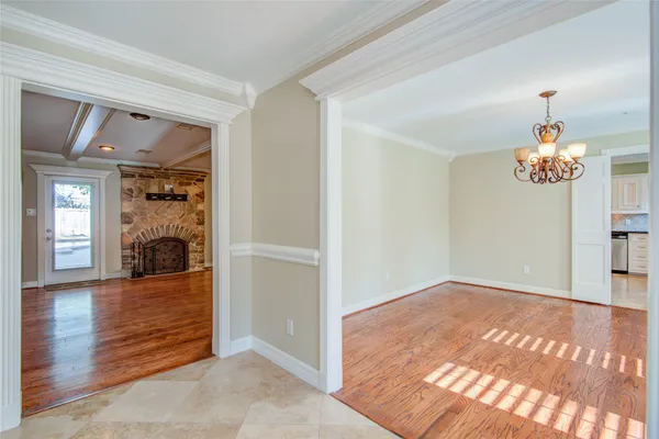 a view interior of a house and an entryway with wooden floor