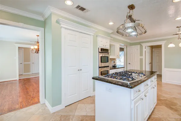 a kitchen that has a lot of cabinets