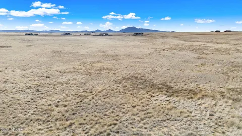 a view of an ocean with a mountain