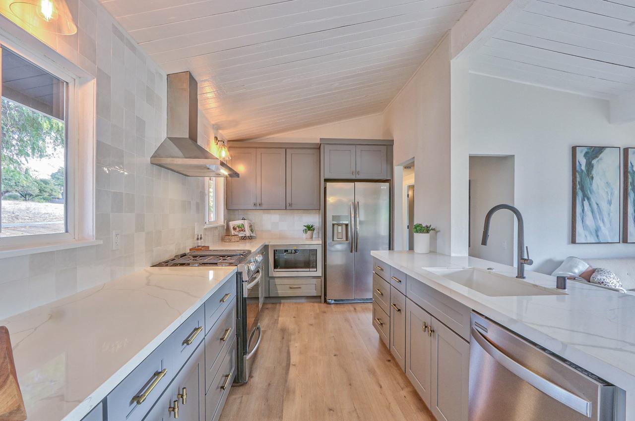 41 Poppy Road Carmel Valley, CA 93924 - Photo 8 of 35 a kitchen with stainless steel appliances a sink stove and refrigerator