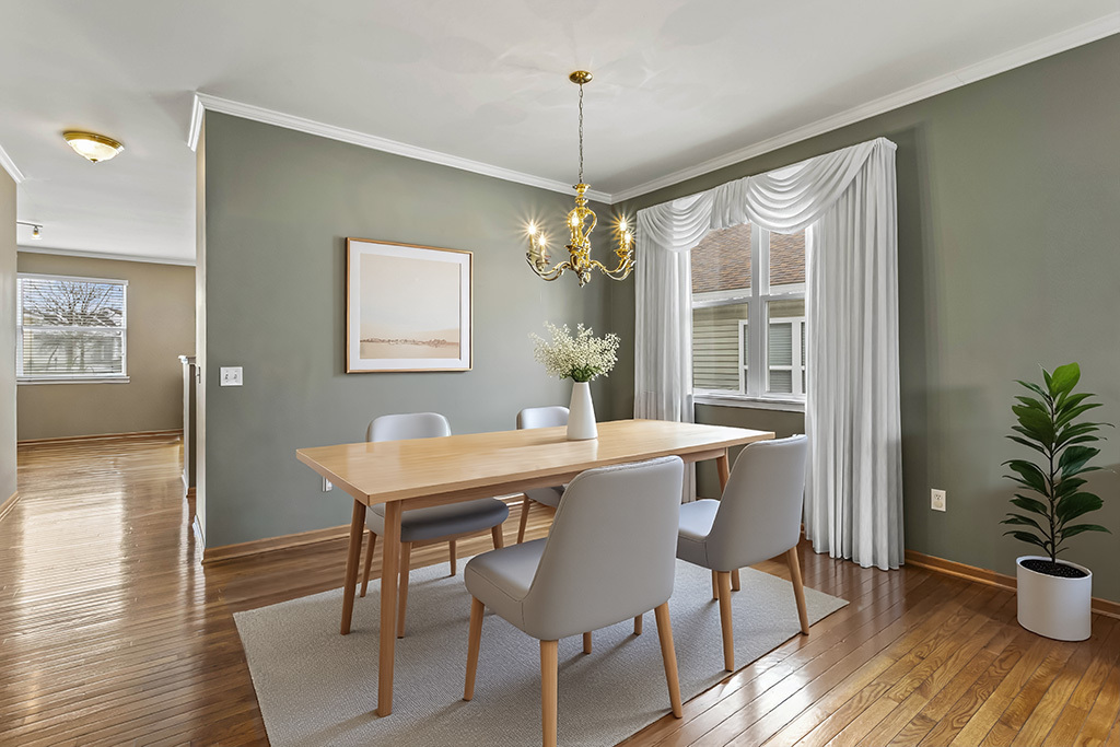 1553 Benzie Circle Romeoville, IL 60446 - Photo 9 of 26 a view of a dining room with furniture window and wooden floor