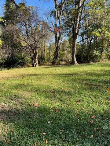 a view of outdoor space with trees all around