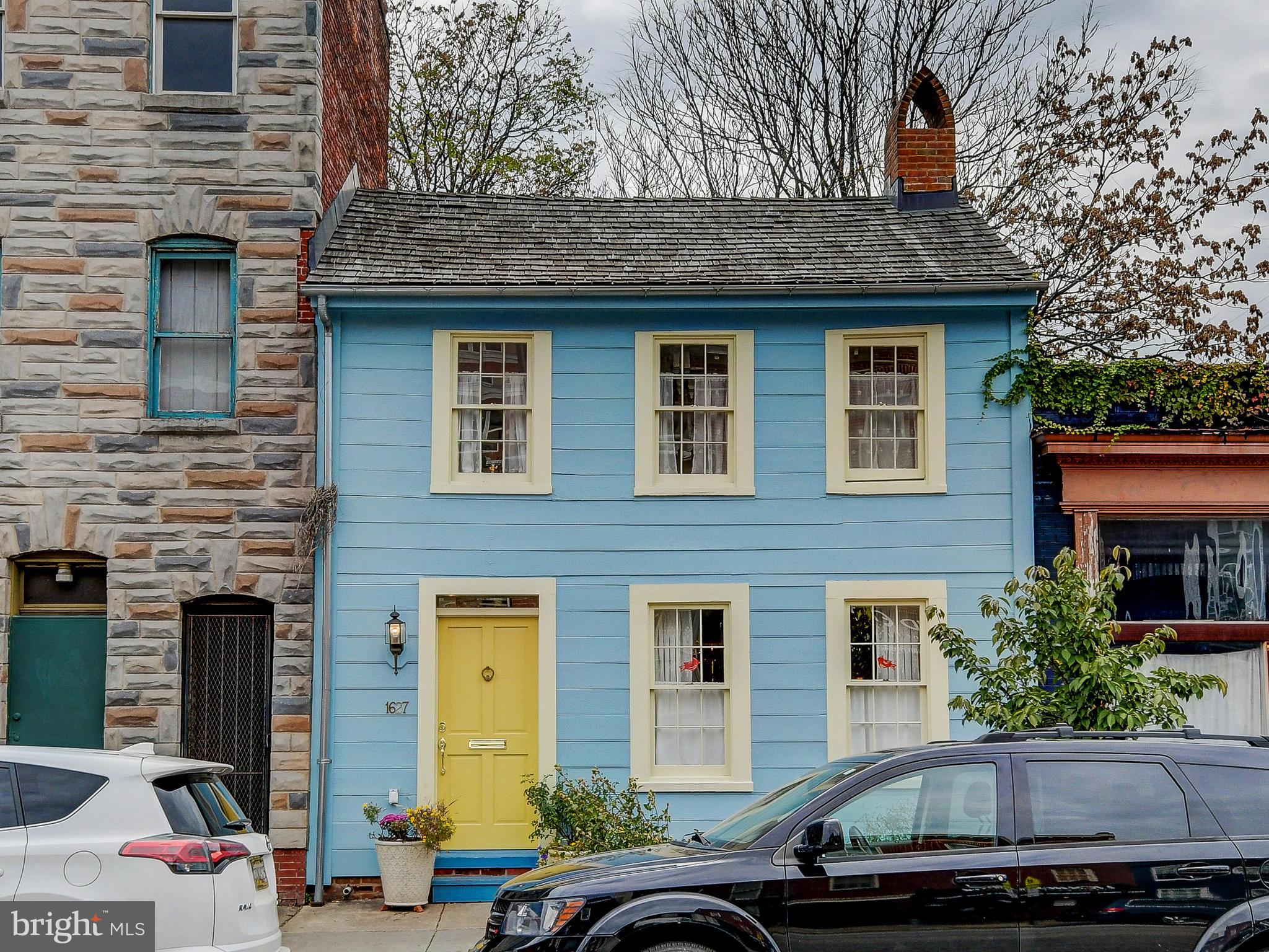 1627 Aliceanna Street Baltimore, MD 21231 - Photo 1 of 60 a front view of a house with parking