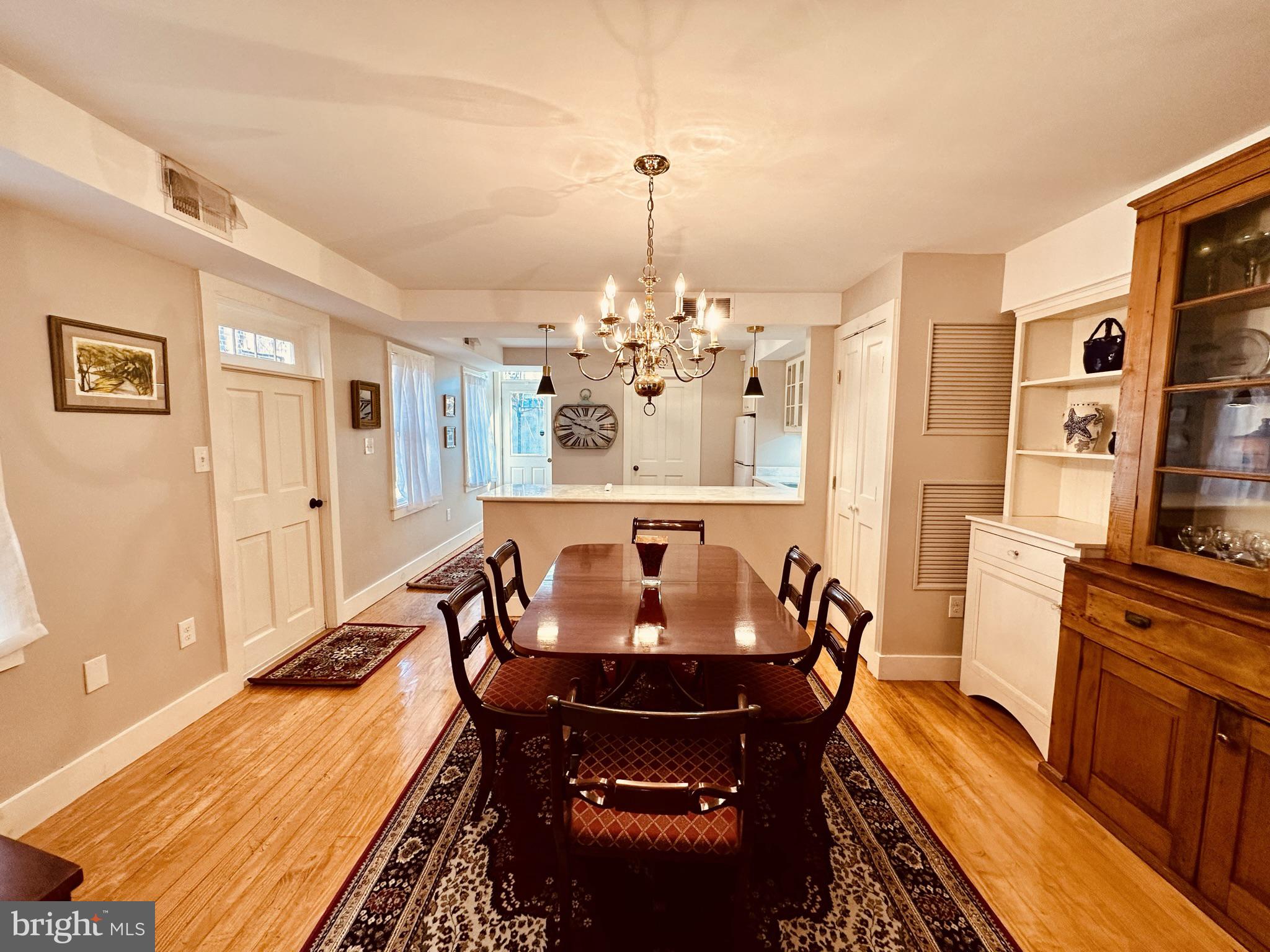 1627 Aliceanna Street Baltimore, MD 21231 - Photo 14 of 60 a view of a dining room with furniture and wooden floor