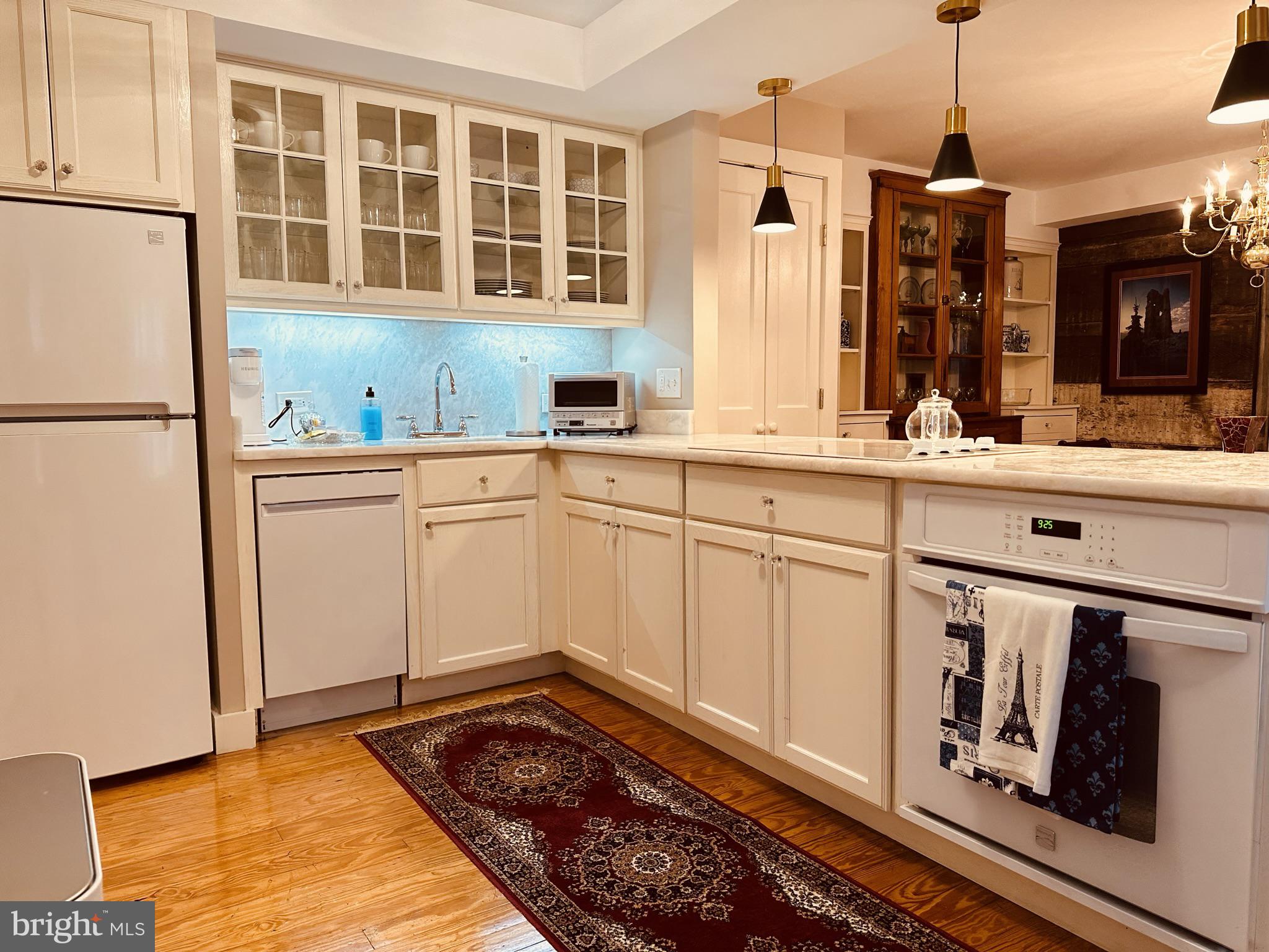 1627 Aliceanna Street Baltimore, MD 21231 - Photo 21 of 60 a kitchen with stainless steel appliances granite countertop a refrigerator and a stove