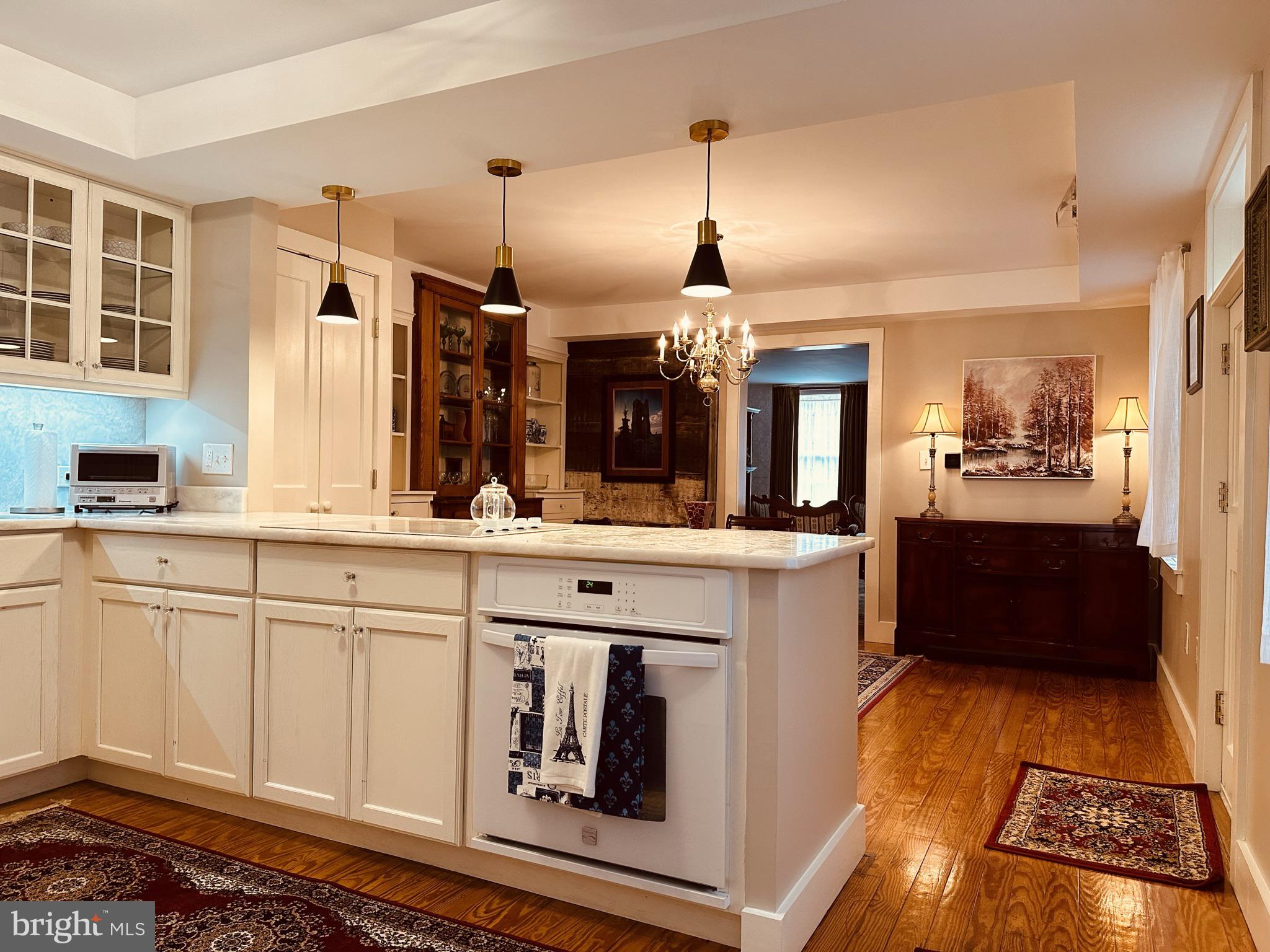 1627 Aliceanna Street Baltimore, MD 21231 - Photo 23 of 60 a kitchen with stainless steel appliances granite countertop a sink and cabinets
