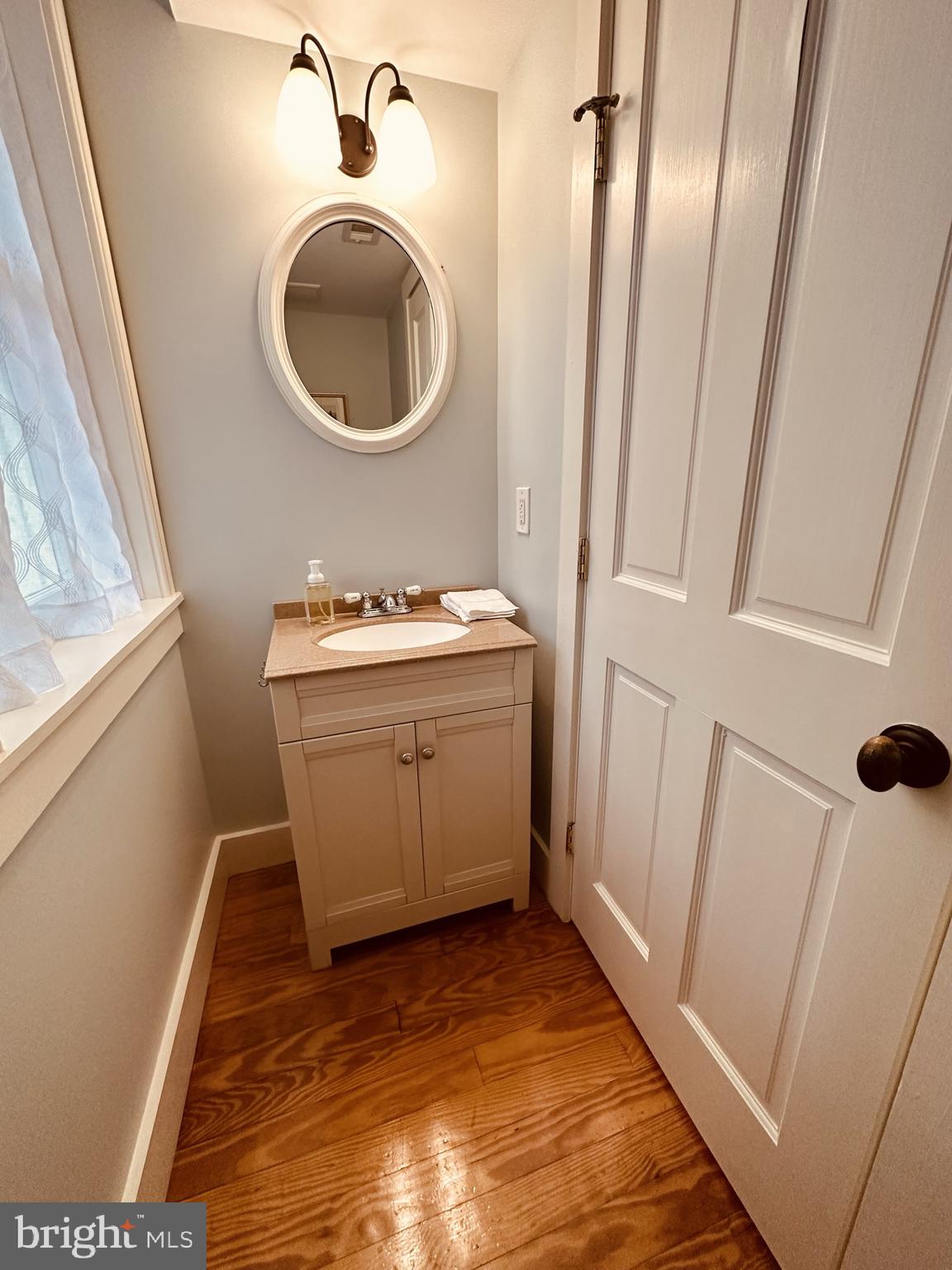 1627 Aliceanna Street Baltimore, MD 21231 - Photo 25 of 60 a bathroom with a sink and a mirror