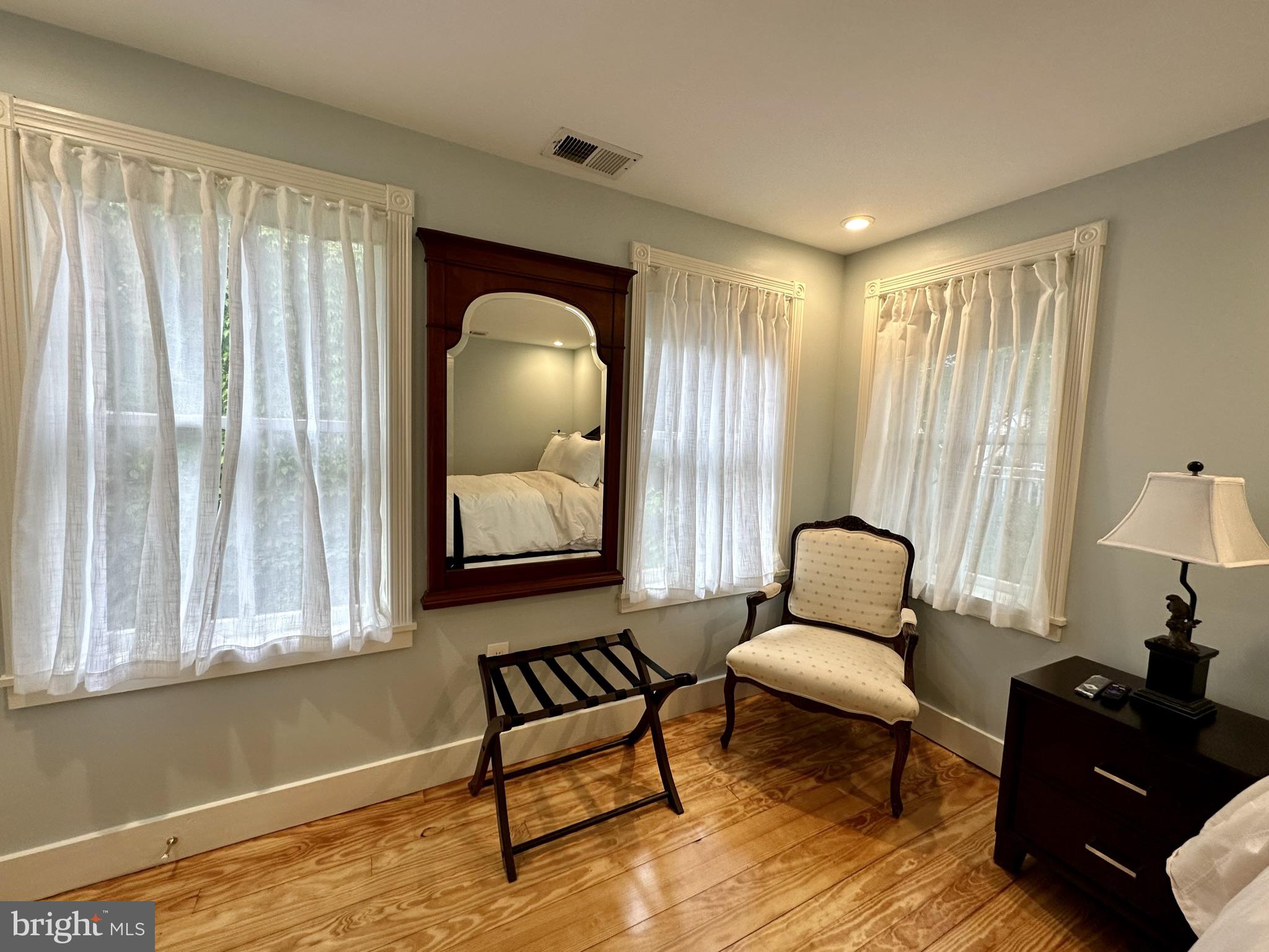 1627 Aliceanna Street Baltimore, MD 21231 - Photo 37 of 60 a living room with furniture and a painting on the wall