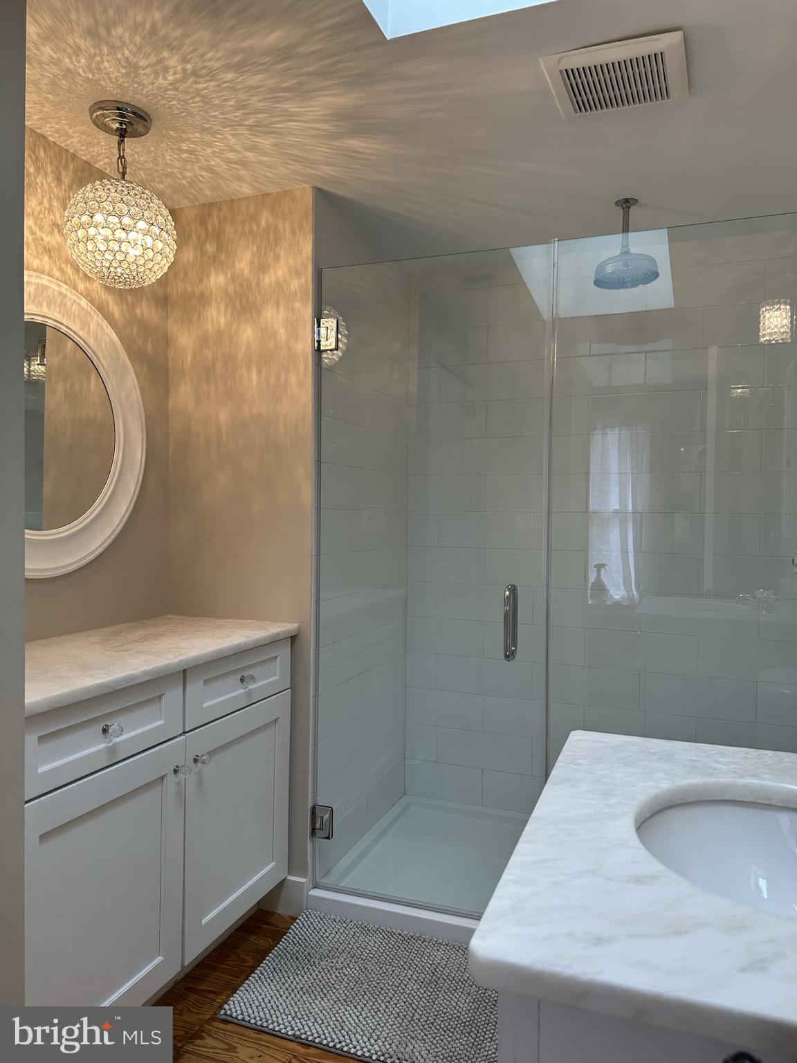 1627 Aliceanna Street Baltimore, MD 21231 - Photo 38 of 60 a bathroom with a sink and a mirror
