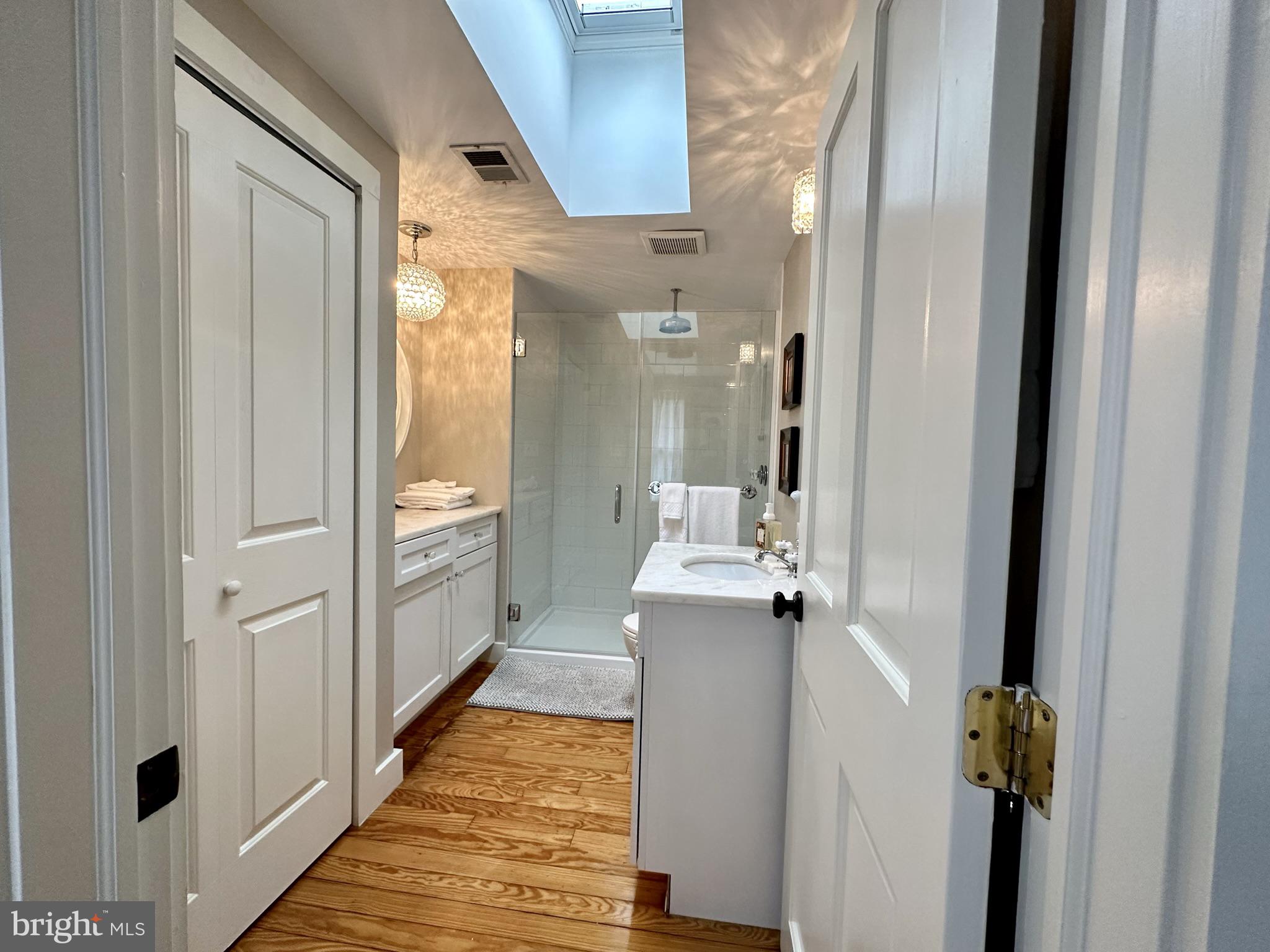 1627 Aliceanna Street Baltimore, MD 21231 - Photo 39 of 60 a view of a hallway with wooden floor and staircase