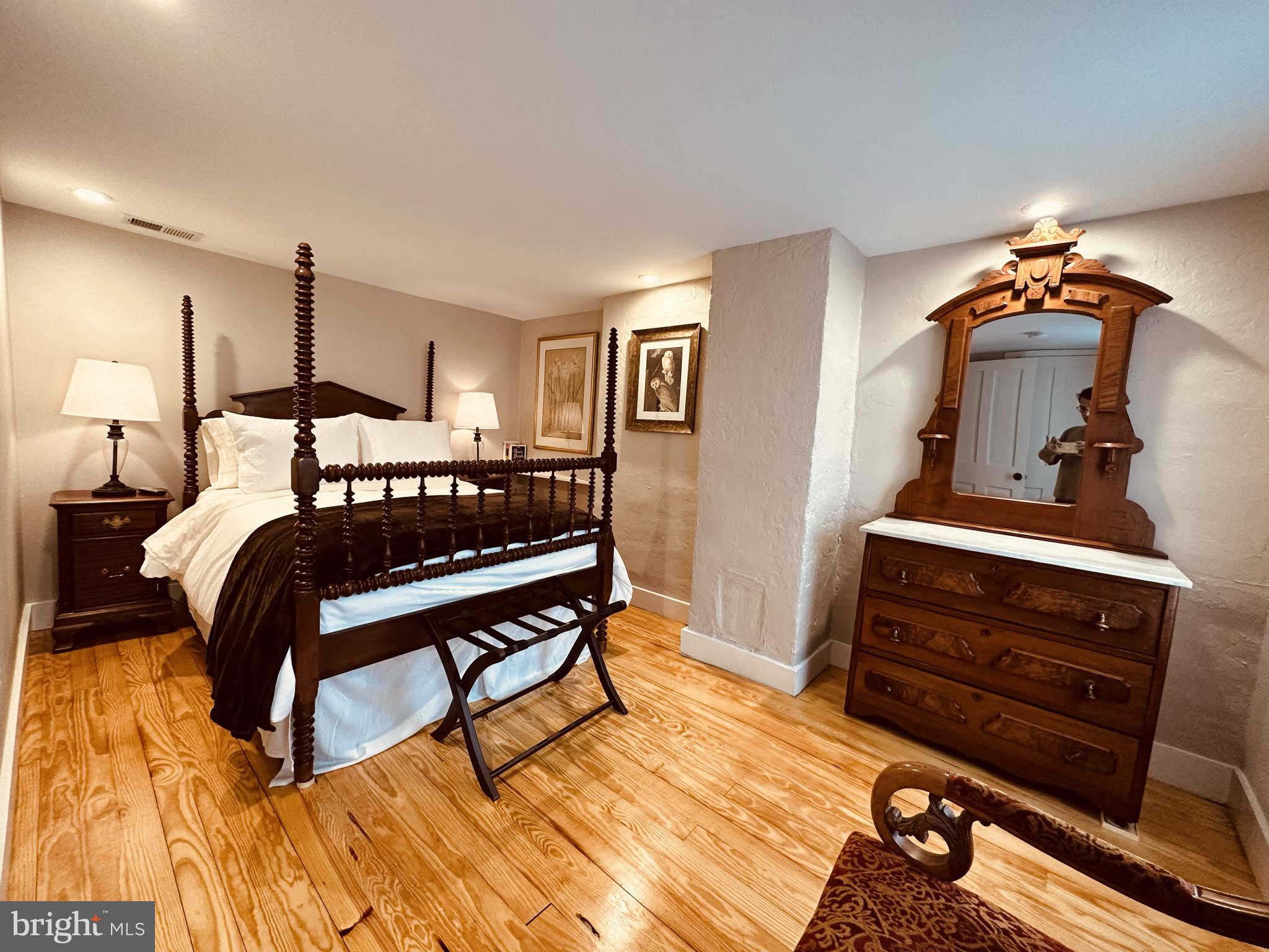 1627 Aliceanna Street Baltimore, MD 21231 - Photo 45 of 60 a bedroom with a bed and a dresser