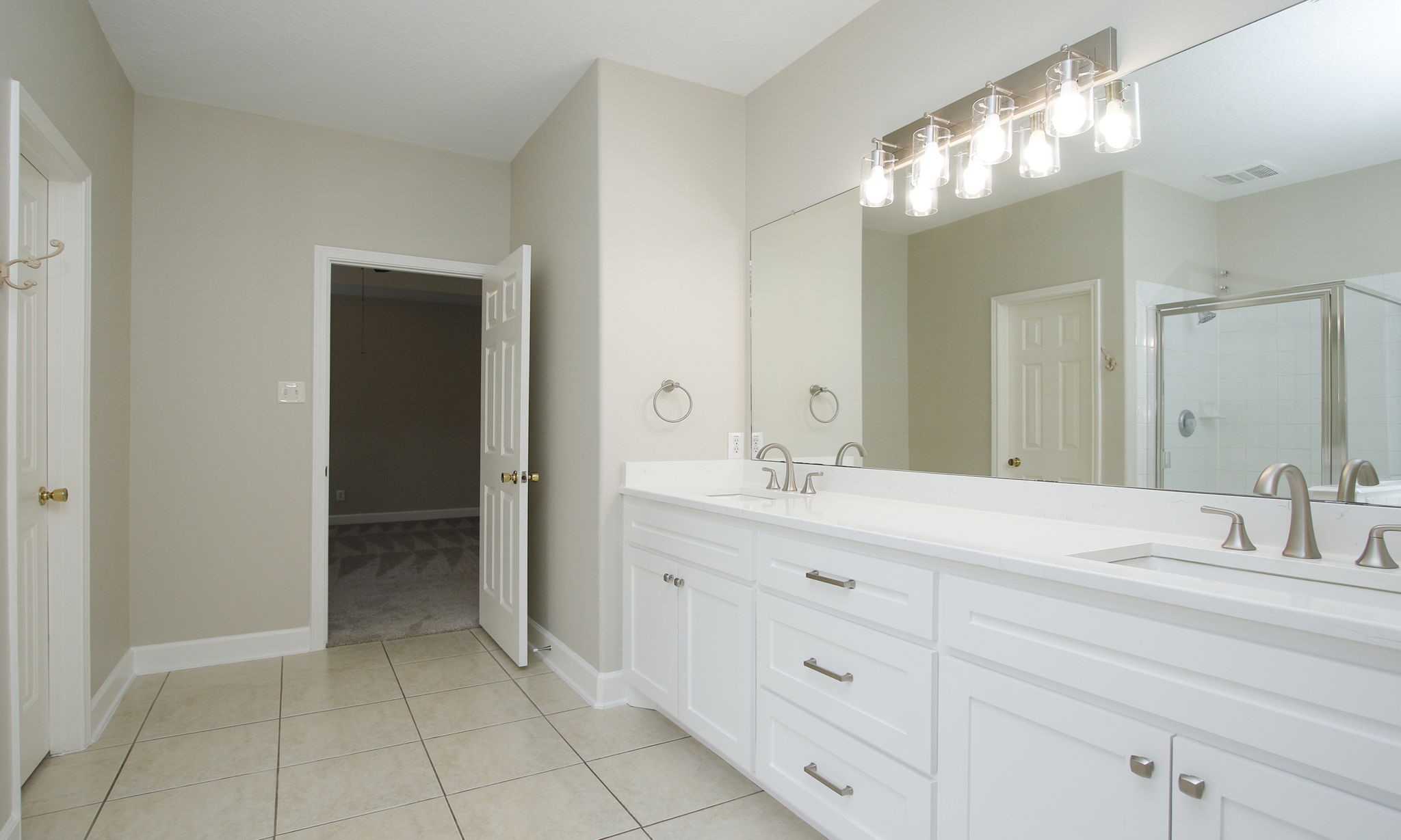 27131 Sunset Pines Drive Spring, TX 77373 - Photo 23 of 44 a bathroom with a sink double vanity and a mirror