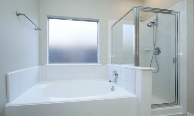 a bathroom with a sink double vanity and a mirror