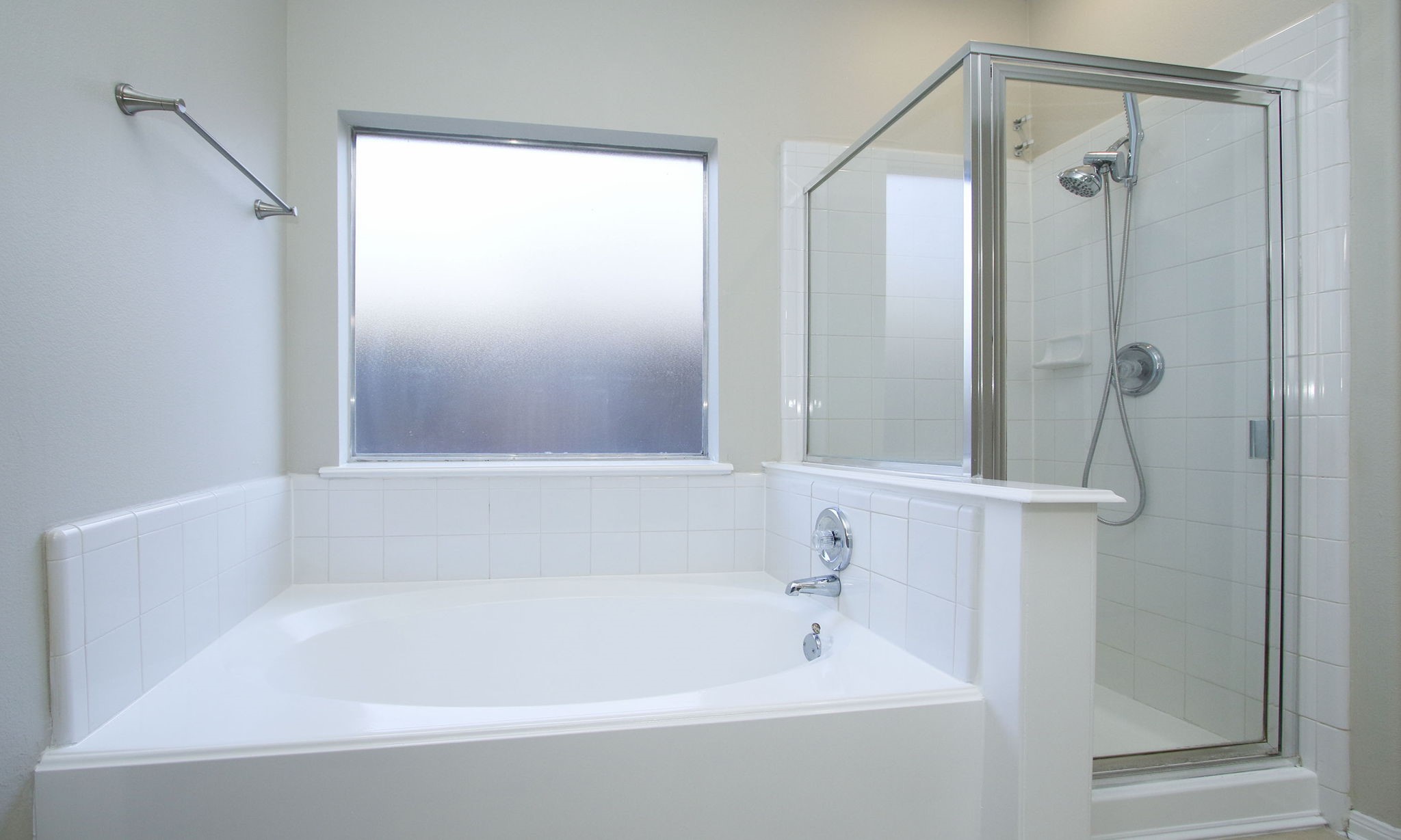 27131 Sunset Pines Drive Spring, TX 77373 - Photo 24 of 44 a bathroom with a bathtub and a shower