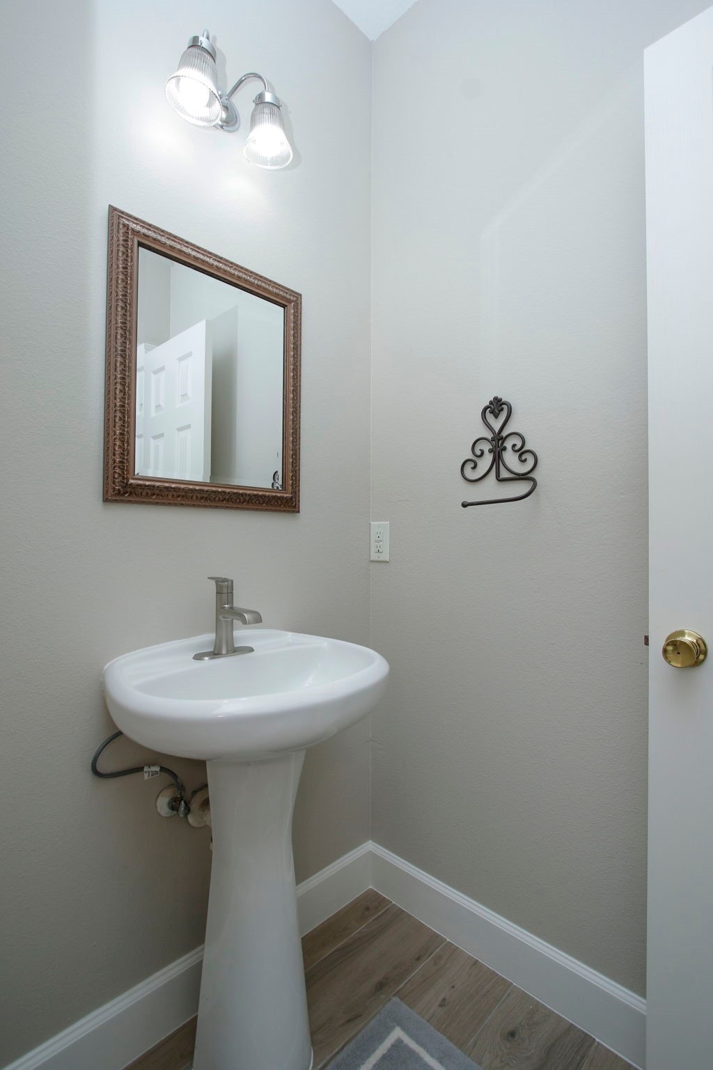 27131 Sunset Pines Drive Spring, TX 77373 - Photo 28 of 44 a bathroom with a sink and mirror