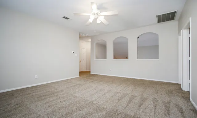 a view of an empty room with a window