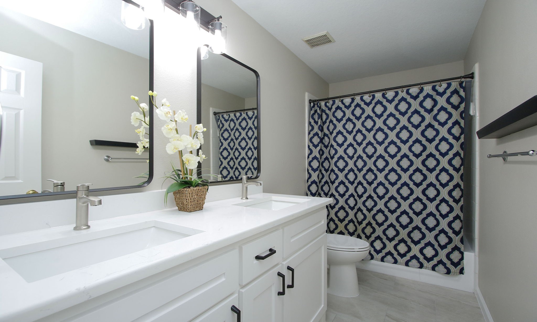 27131 Sunset Pines Drive Spring, TX 77373 - Photo 36 of 44 a bathroom with a sink and a mirror