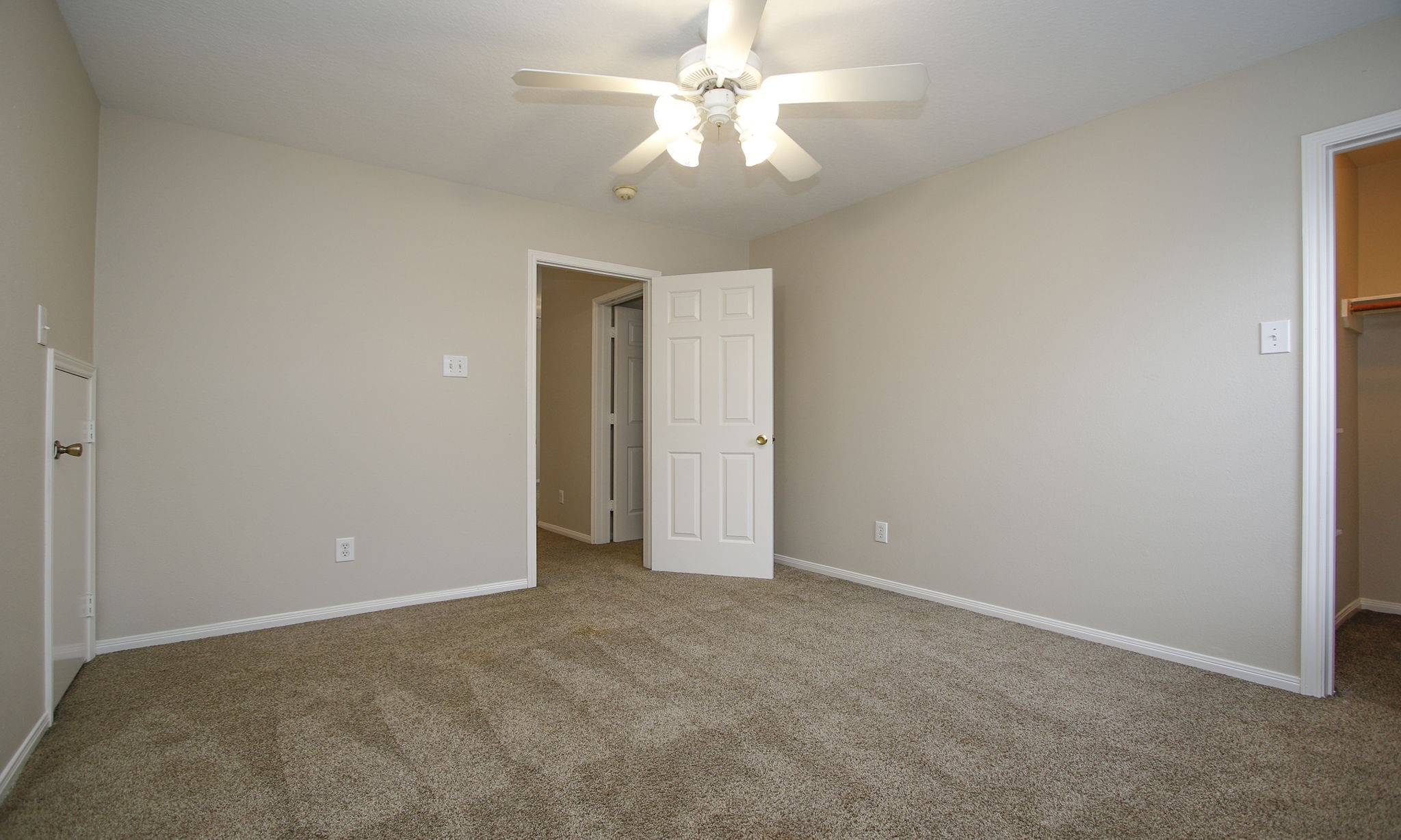 27131 Sunset Pines Drive Spring, TX 77373 - Photo 38 of 44 an empty room with a fan and a ceiling fan