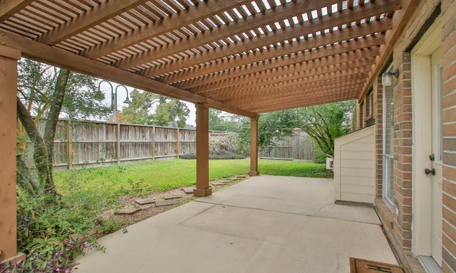 an empty room with a fan and a ceiling fan