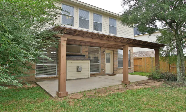 a view of back yard with porch