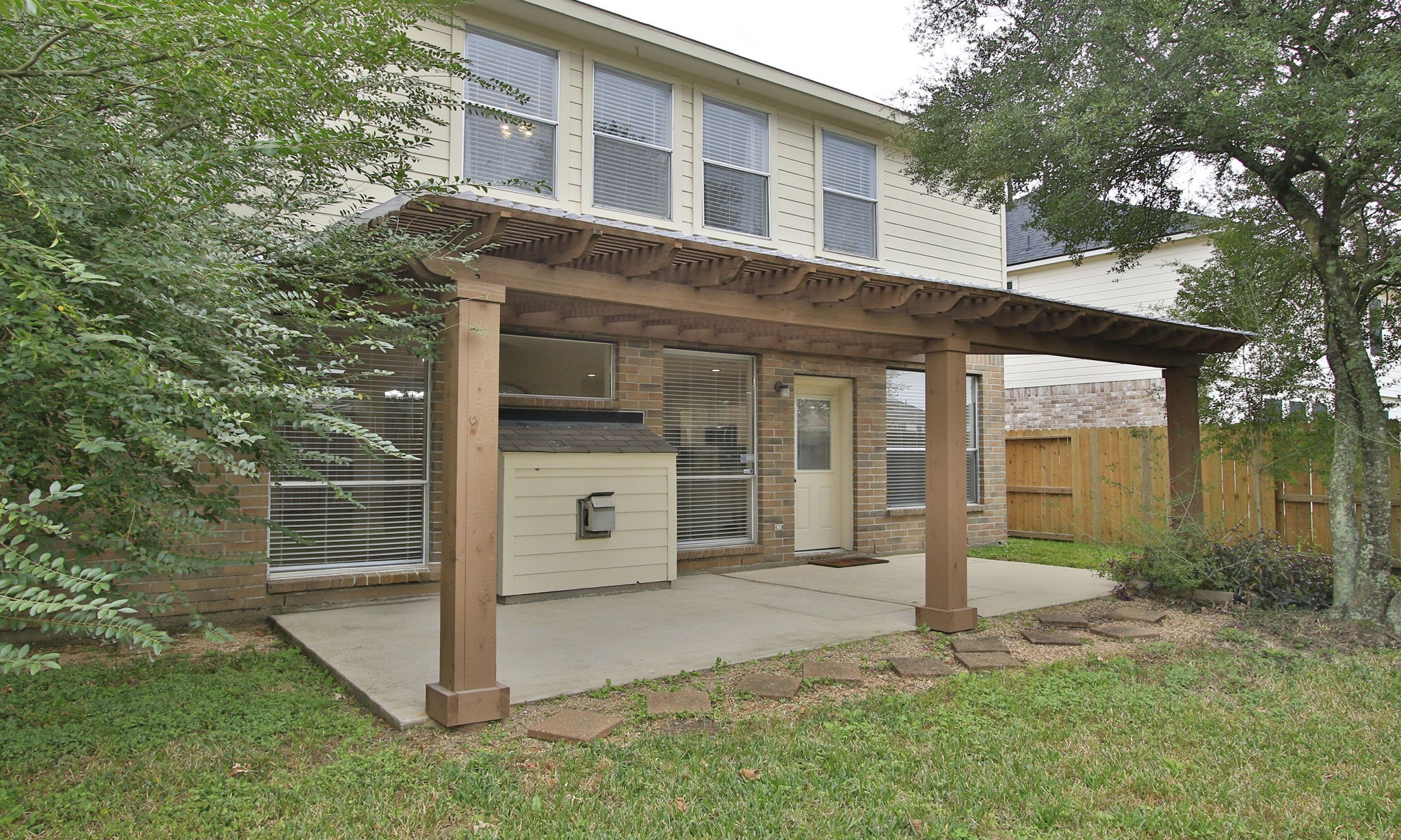 27131 Sunset Pines Drive Spring, TX 77373 - Photo 40 of 44 a front view of a house with a yard and porch