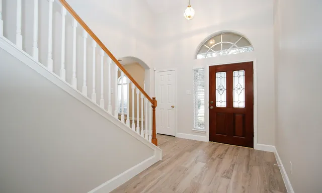 a view of staircase with wooden floor and staircase